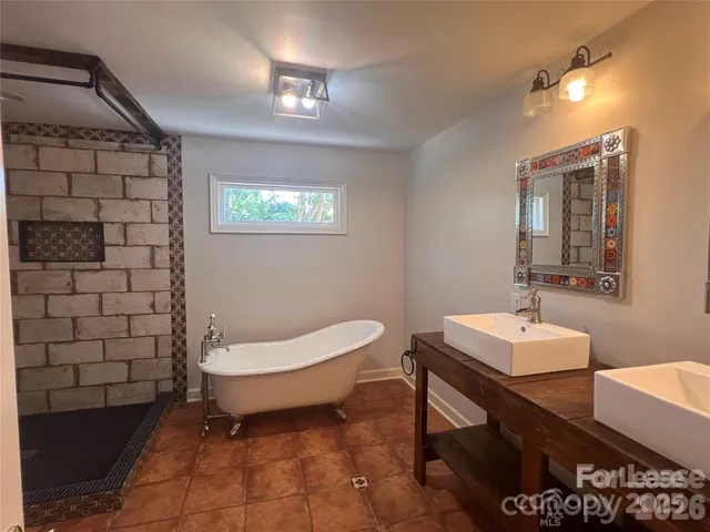 a bathroom with a sink toilet and mirror