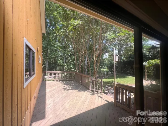 a view of a porch with wooden floor and outdoor space