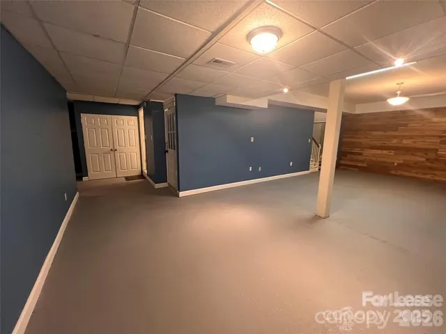 a view of a livingroom with an empty space and a window