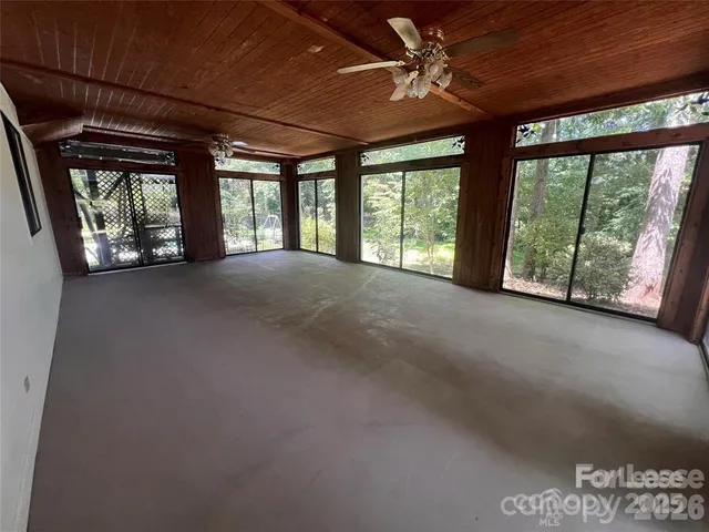 a view of an empty room with a balcony