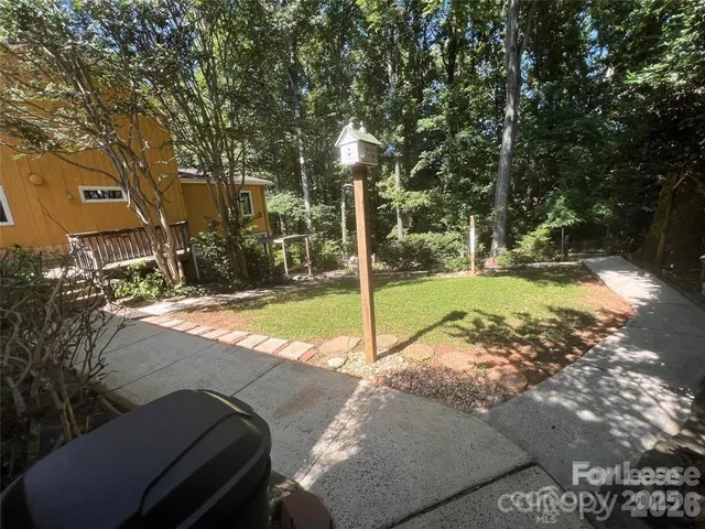a view of a park with large trees