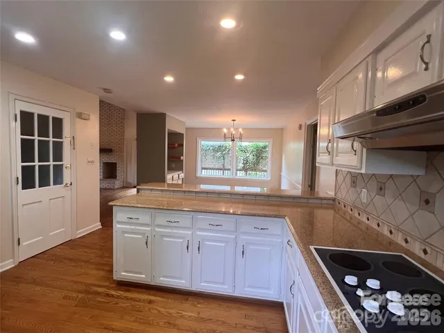 a kitchen with wooden cabinets and a sink
