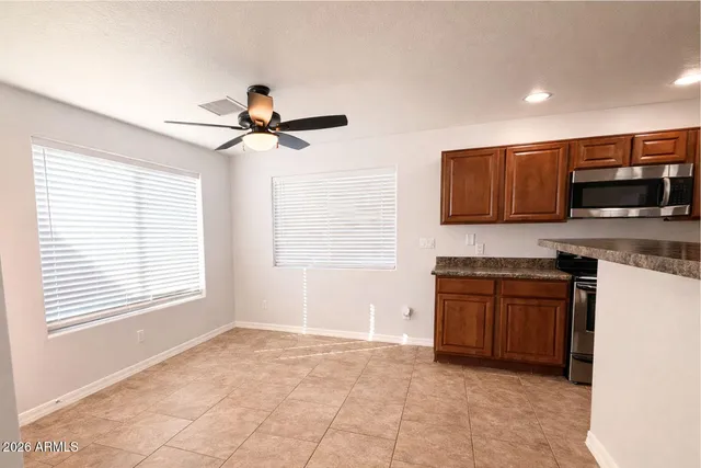 a kitchen with stainless steel appliances granite countertop a stove and a sink