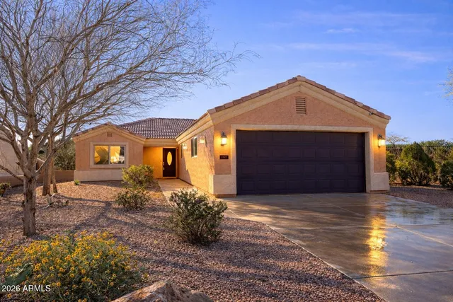 a front view of a house with a yard