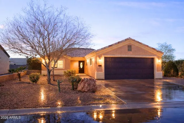 a front view of a house with yard