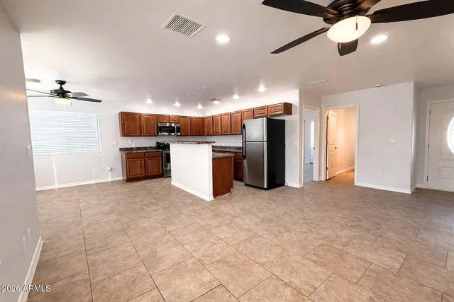 a view of kitchen and a refrigerator in a kitchen