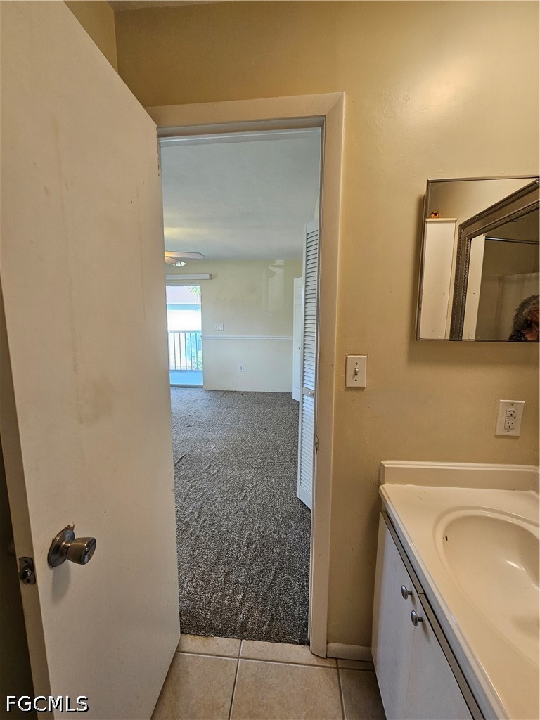 8101 Country Road, Unit 201 Fort Myers, FL 33919 - Photo 28 of 34 a bathroom with a granite countertop sink and a mirror