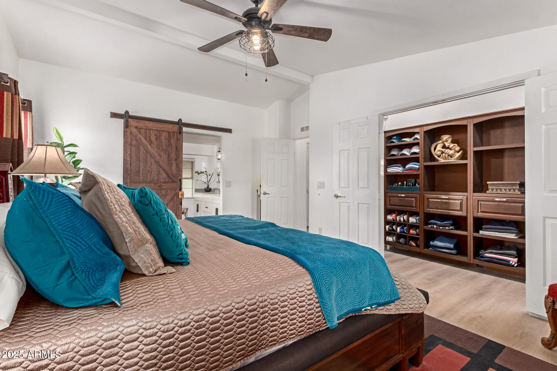 39234 West Buckeye Road Tonopah, AZ 85354 - Photo 13 of 40 a bedroom with a large bed and a dresser