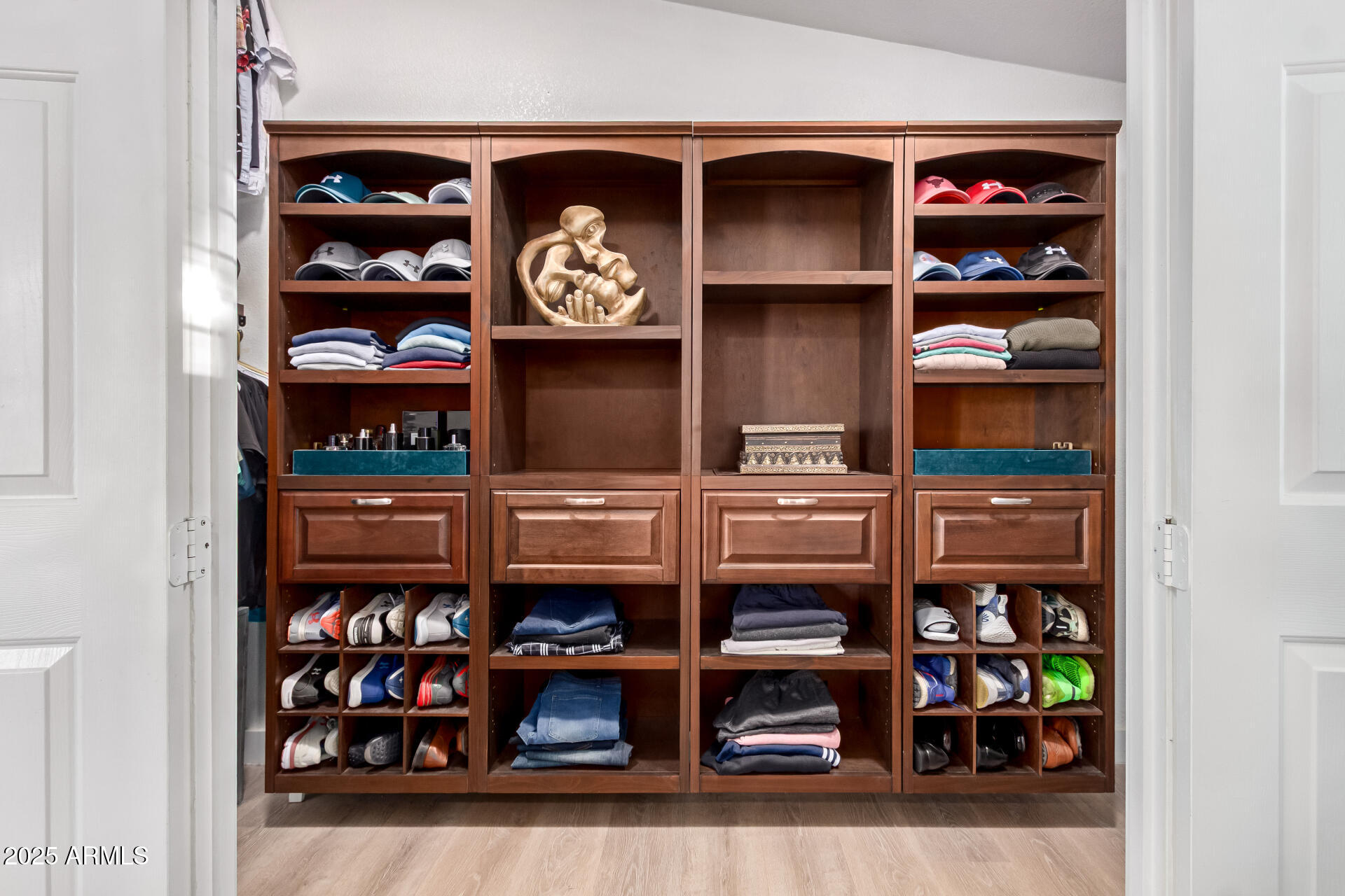 39234 West Buckeye Road Tonopah, AZ 85354 - Photo 17 of 40 a shelf with books and knick knacks on it