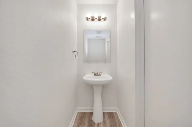 a view of an entryway with wooden floor