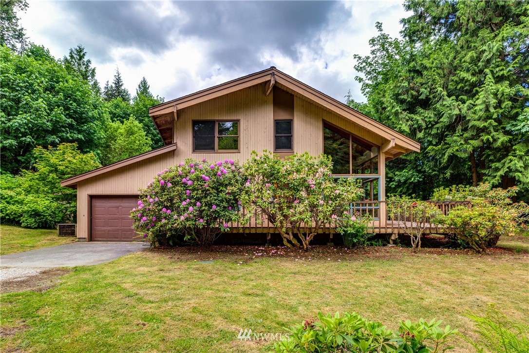1309 Old Samish Road Bellingham, WA 98229 - Photo 1 of 40 a front view of a house with a garden