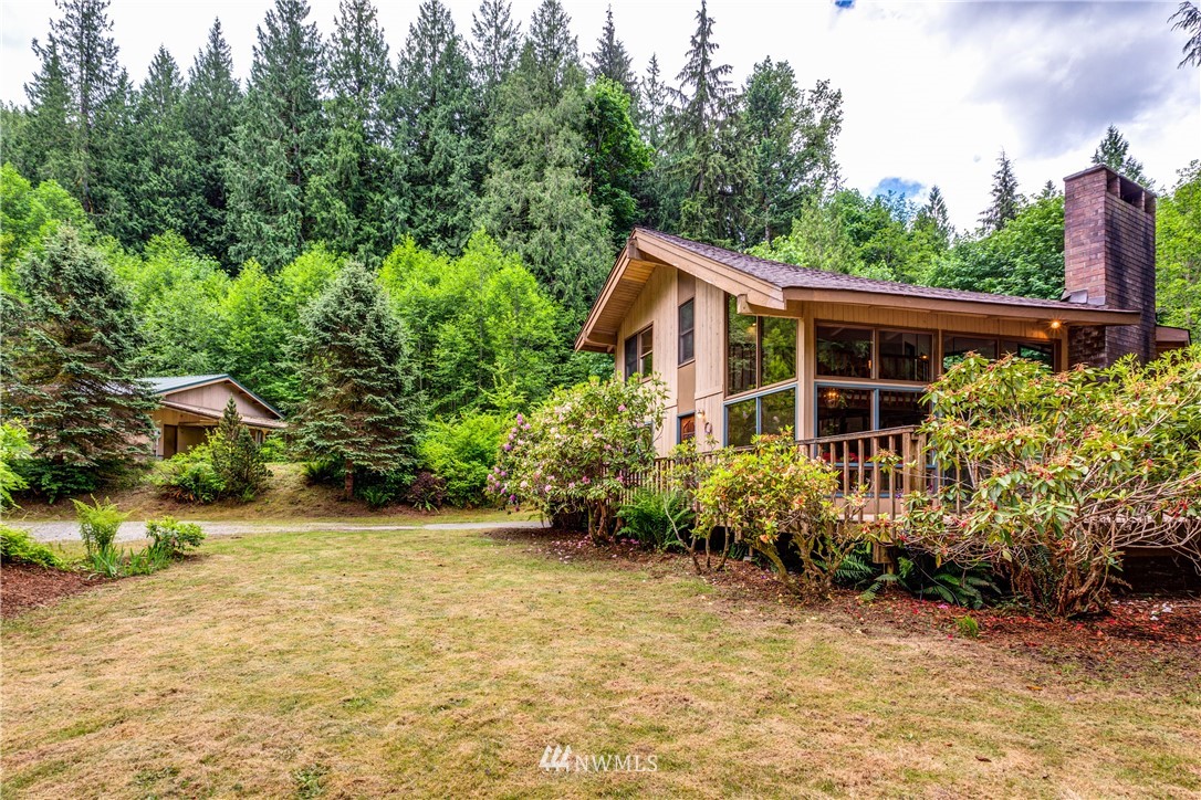 1309 Old Samish Road Bellingham, WA 98229 - Photo 2 of 40 a view of a garden with plants and large trees
