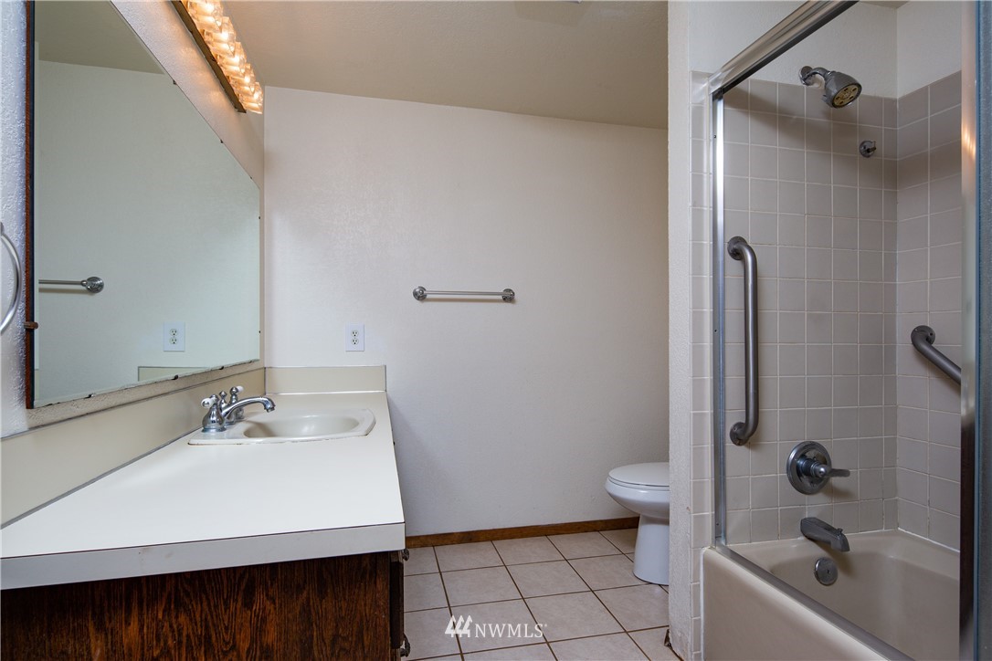1309 Old Samish Road Bellingham, WA 98229 - Photo 12 of 40 a bathroom with a sink a toilet and shower