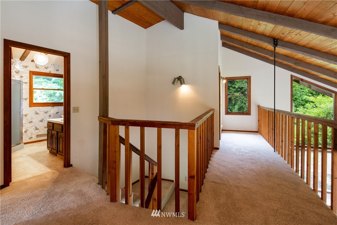 1309 Old Samish Road Bellingham, WA 98229 - Photo 14 of 40 a view of a hallway with wooden floor and stairs