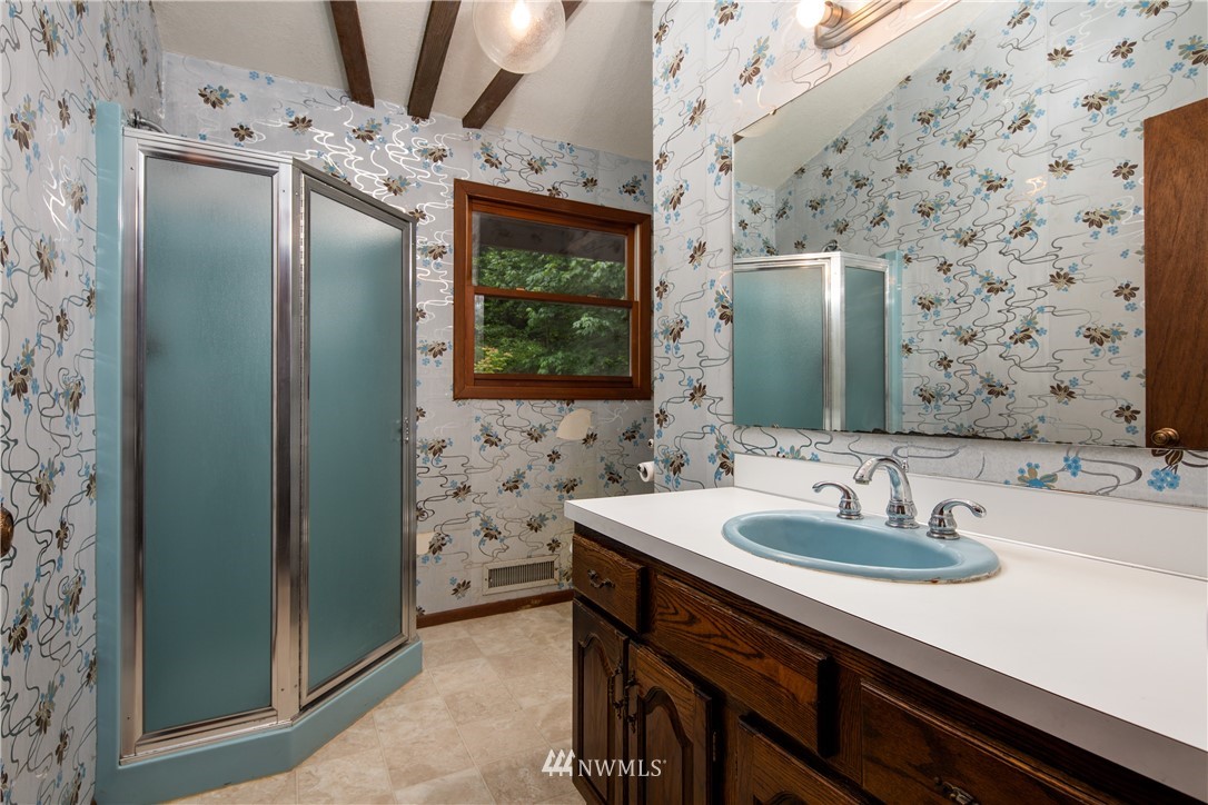 1309 Old Samish Road Bellingham, WA 98229 - Photo 19 of 40 a bathroom with a sink a vanity and a mirror