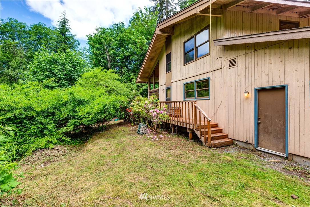 1309 Old Samish Road Bellingham, WA 98229 - Photo 25 of 40 a view of a house with a yard and sitting area