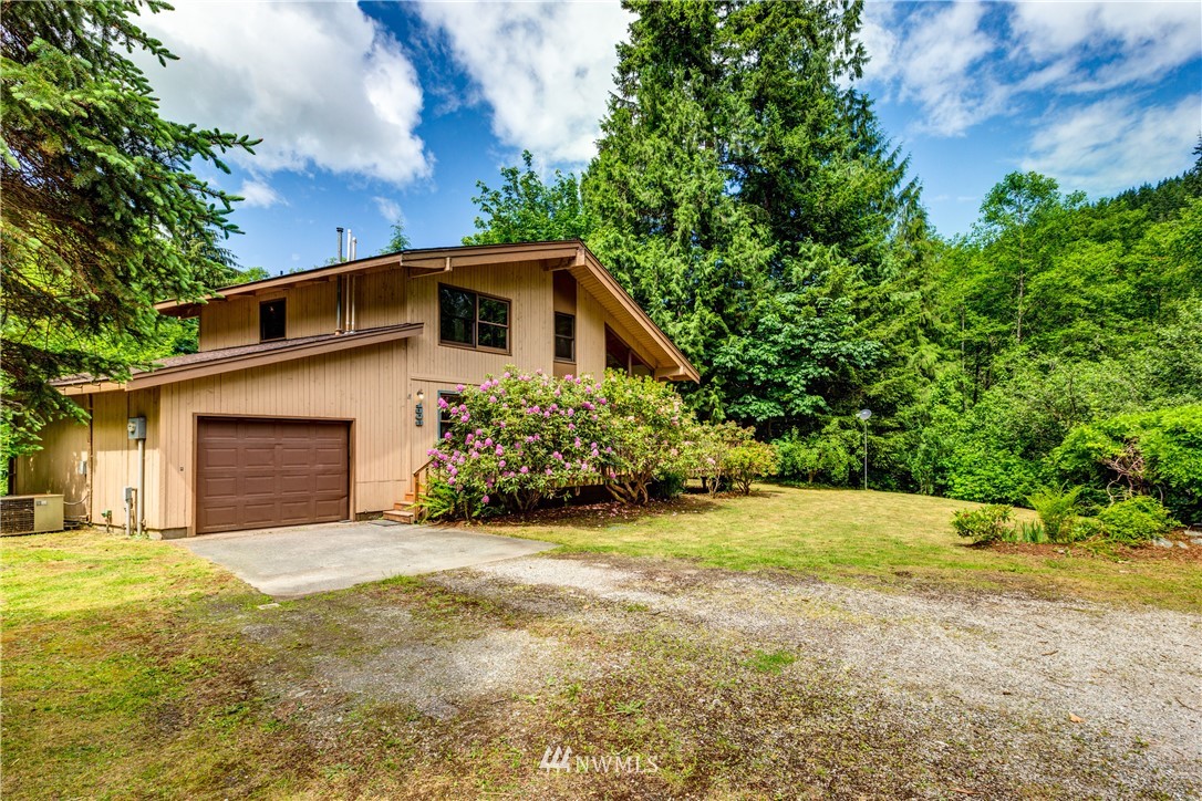 1309 Old Samish Road Bellingham, WA 98229 - Photo 29 of 40 a front view of a house with a yard and garage