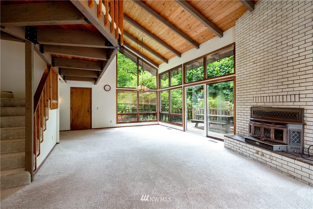 1309 Old Samish Road Bellingham, WA 98229 - Photo 4 of 40 a view of an empty room with a fireplace and a window