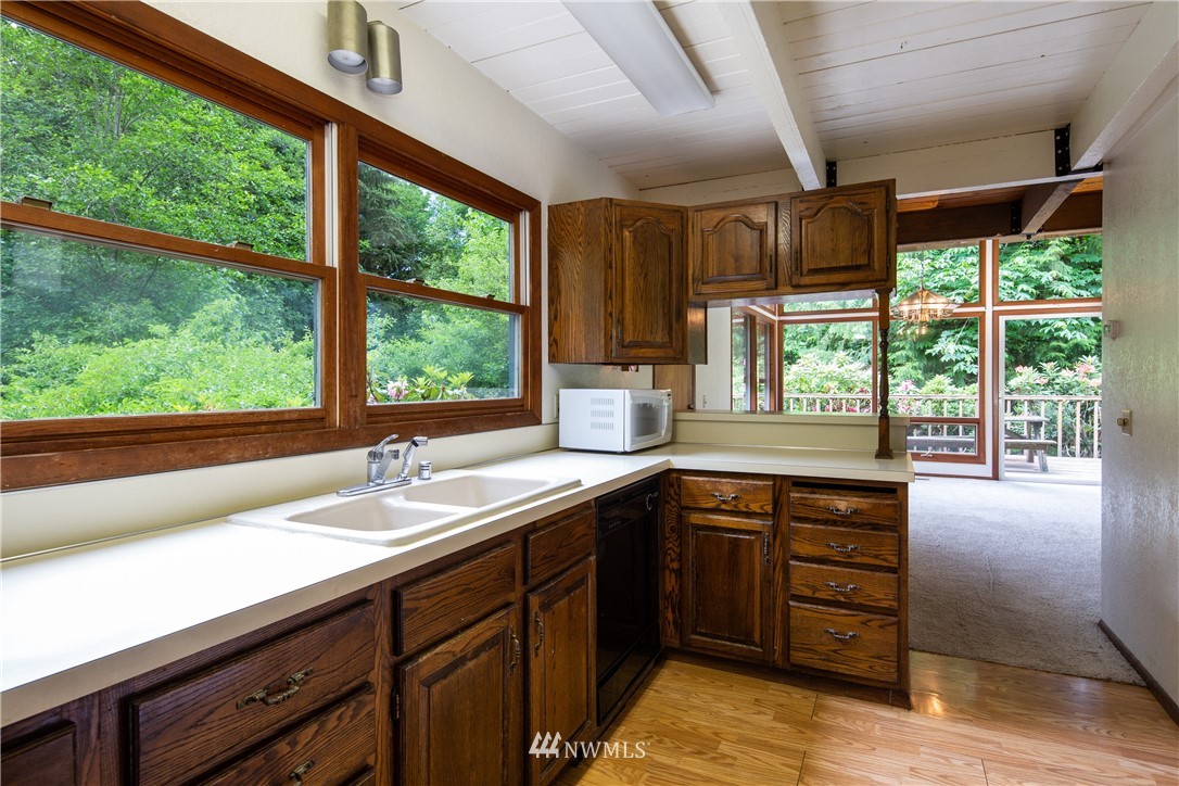 1309 Old Samish Road Bellingham, WA 98229 - Photo 9 of 40 a kitchen with a sink and large window