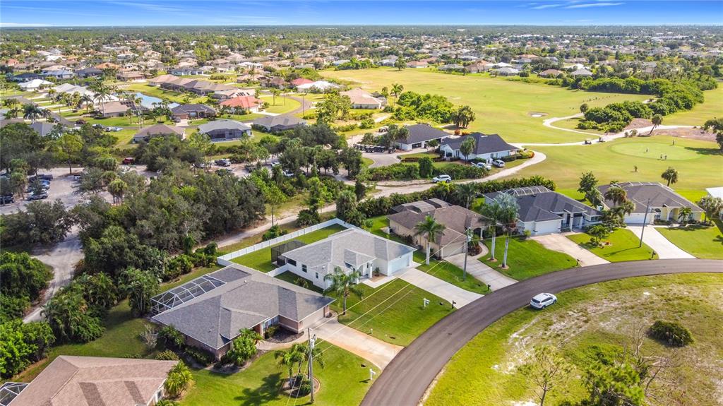 26 Medalist Way Rotonda West, FL 33947 - Photo 13 of 63 an aerial view of residential houses with outdoor space