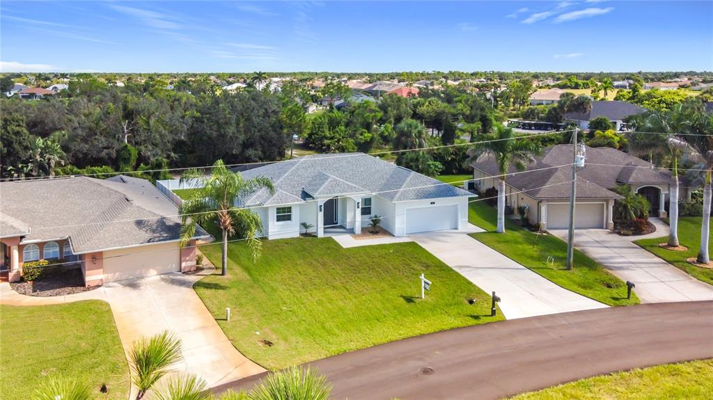 26 Medalist Way Rotonda West, FL 33947 - Photo 15 of 63 an aerial view of a house with swimming pool garden and outdoor seating