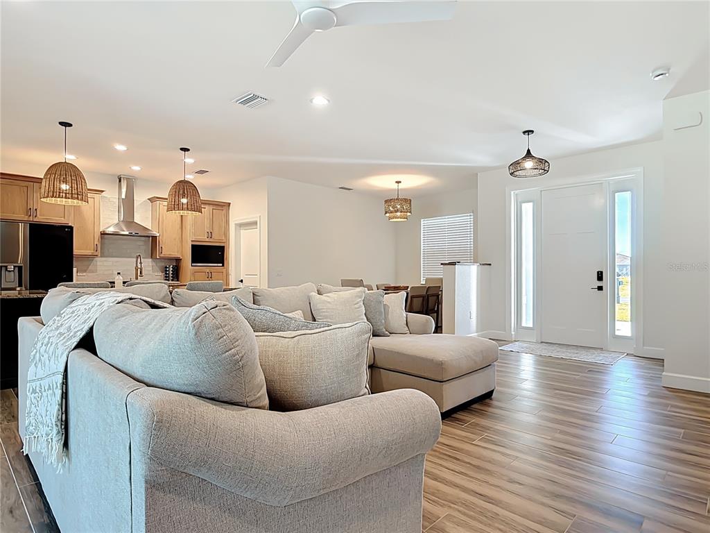 26 Medalist Way Rotonda West, FL 33947 - Photo 25 of 63 a living room with furniture and wooden floor
