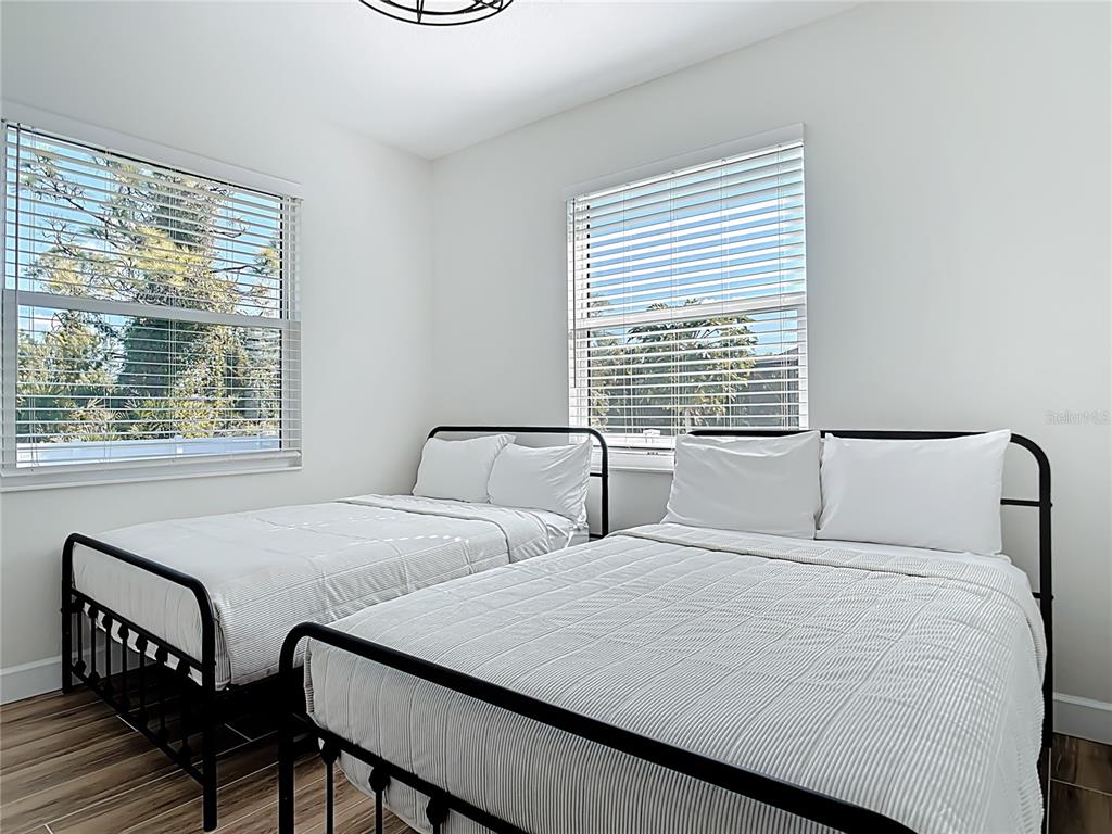 26 Medalist Way Rotonda West, FL 33947 - Photo 37 of 63 a bedroom with two beds and a window