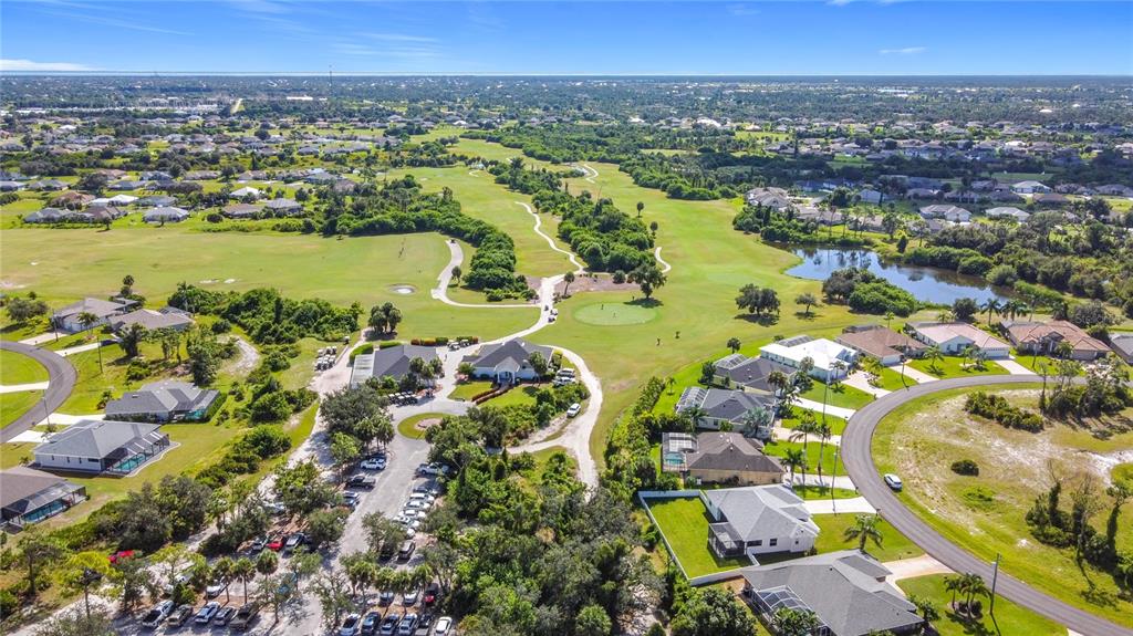 26 Medalist Way Rotonda West, FL 33947 - Photo 59 of 63 an aerial view of ocean and residential houses with outdoor space