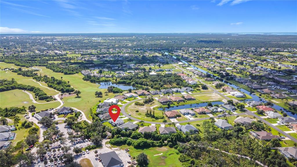 26 Medalist Way Rotonda West, FL 33947 - Photo 8 of 63 an aerial view of residential building and city