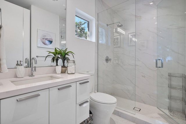 an aerial view of a house with yard swimming pool and outdoor seating