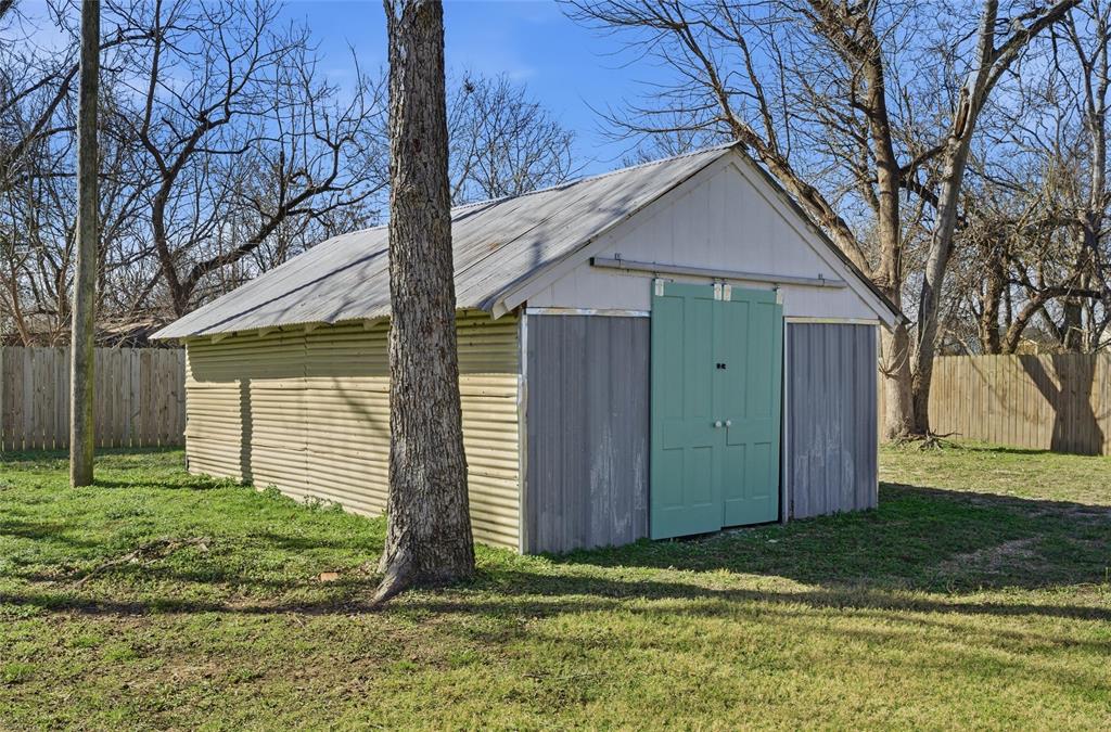 3801 South 4th Street Waco, TX 76706 - Photo 23 of 26 a view of a house with backyard and trees