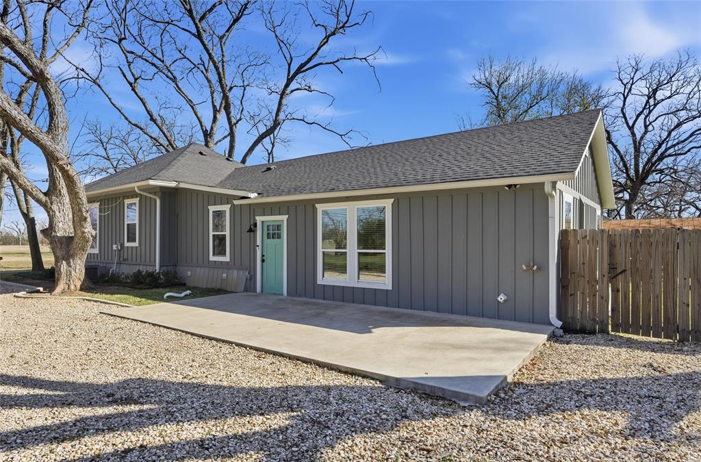 3801 South 4th Street Waco, TX 76706 - Photo 25 of 26 a front view of a house with a yard covered in front and porch