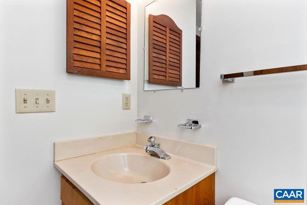 434 3 Ridges Roseland, VA 22967 - Photo 14 of 33 a bathroom with a sink and a mirror