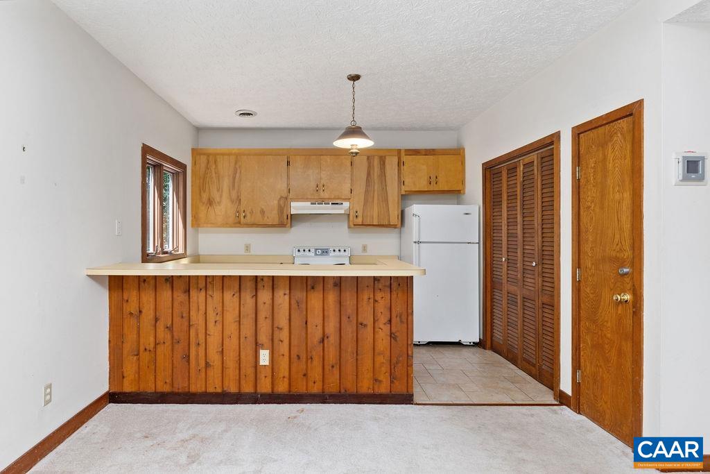 434 3 Ridges Roseland, VA 22967 - Photo 2 of 33 a kitchen with a refrigerator a sink and cabinets