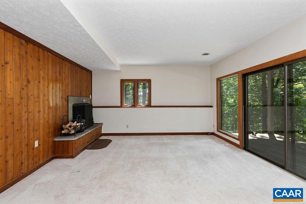434 3 Ridges Roseland, VA 22967 - Photo 7 of 33 a living room with furniture a flat screen tv and a large window