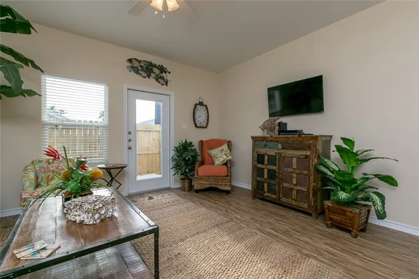 a room with furniture and a potted plant