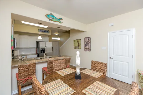 a view of a kitchen and dining room