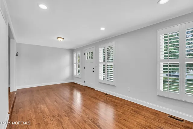 a kitchen with stainless steel appliances granite countertop a stove a refrigerator and a cabinets