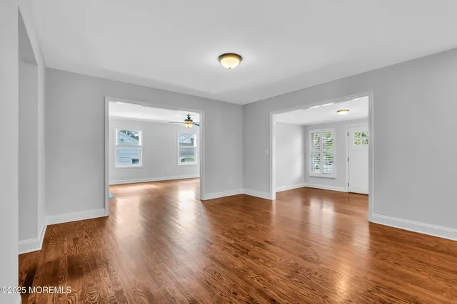 a kitchen with granite countertop a sink a counter top space stainless steel appliances and cabinets