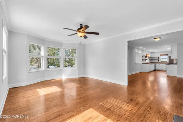 a view of an empty room with a fan