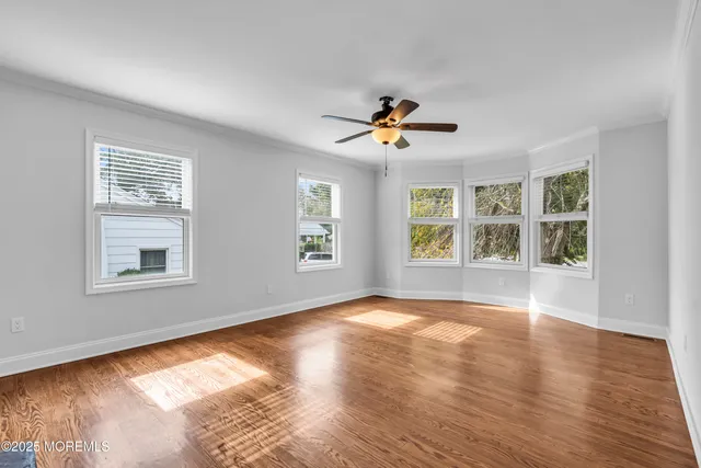 an aerial view of a house with a garden and trees