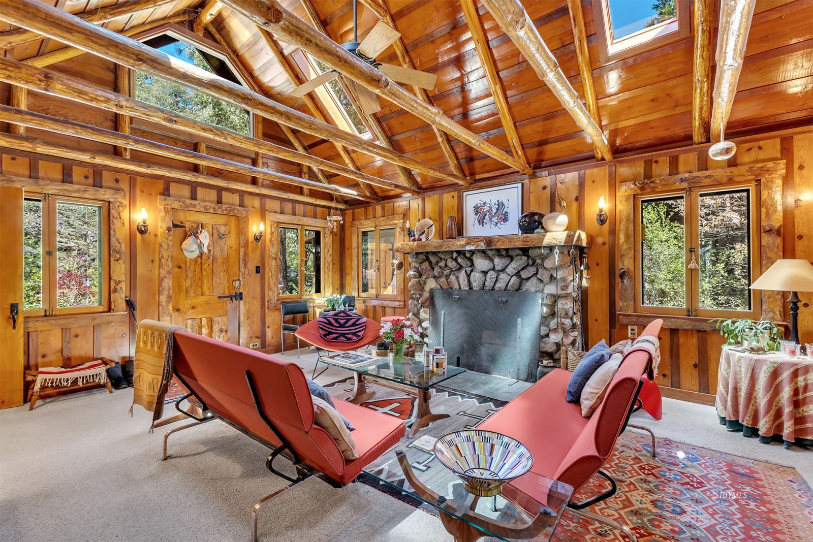 25100 Indian Rock Road Idyllwild, CA 92549 - Photo 13 of 75 a outdoor living space with patio furniture and a fireplace