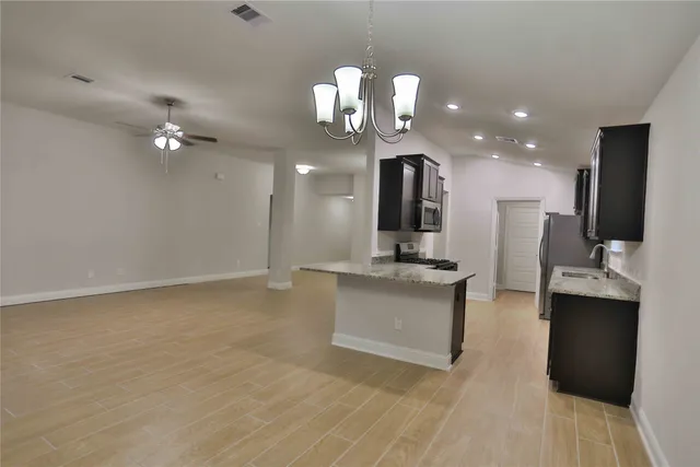 a view of living room kitchen with stainless steel appliances granite countertop living room view and living room