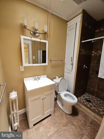 a very nice looking room with wooden floor and a window