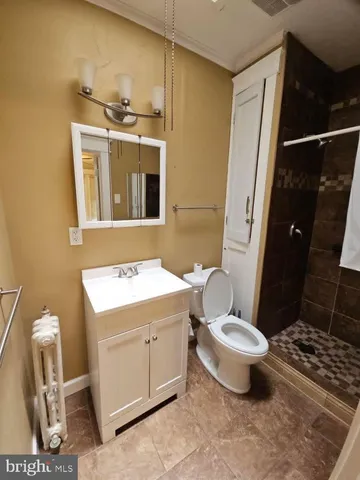 a very nice looking room with wooden floor and a window