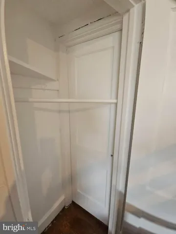 a view of entryway and kitchen