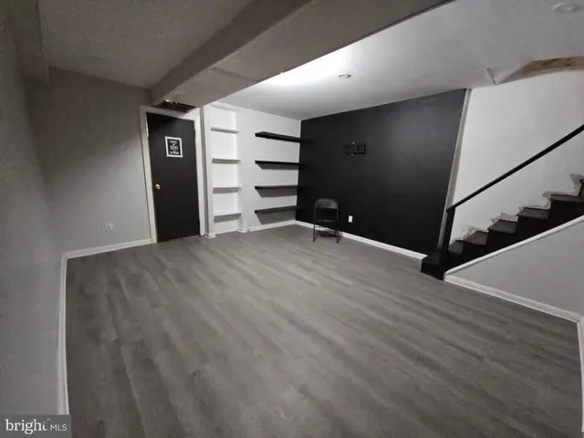 a view of a street with a parked cars