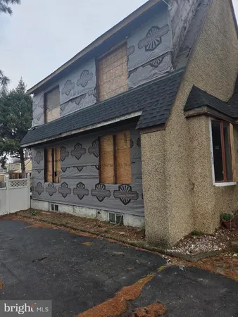 a front view of a house with parking