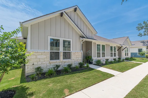 a view of a yard in front of a house