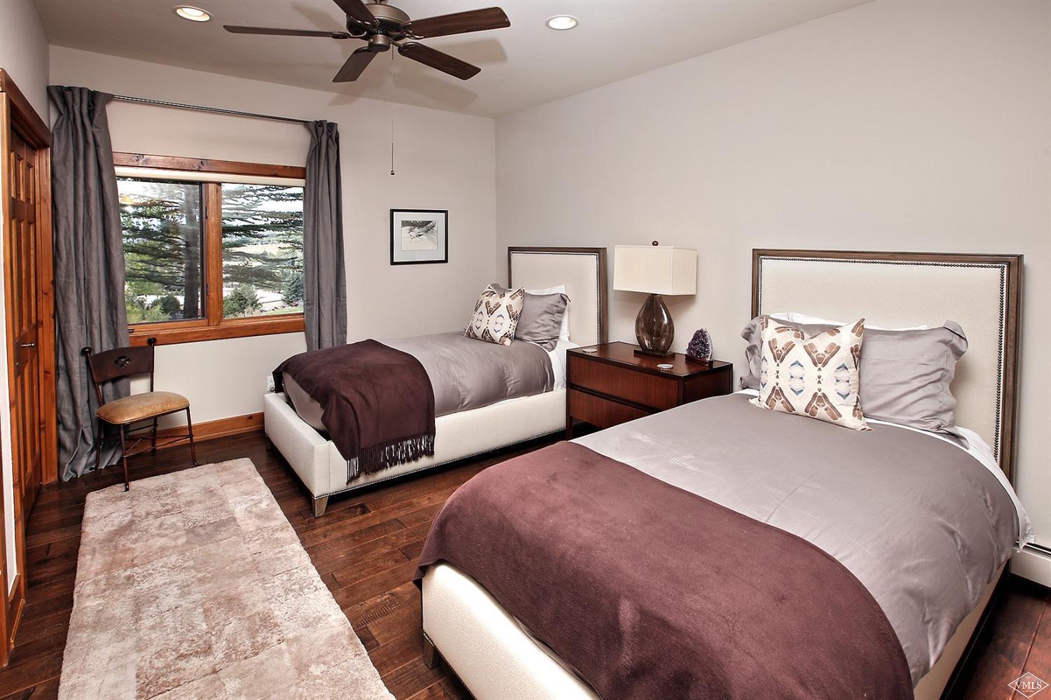 179 Knudson Ranch Road Edwards, CO 81632 - Photo 11 of 21 a bedroom with two beds and a couch